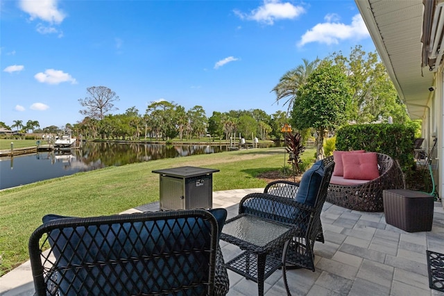 view of patio / terrace with a boat dock and a water view