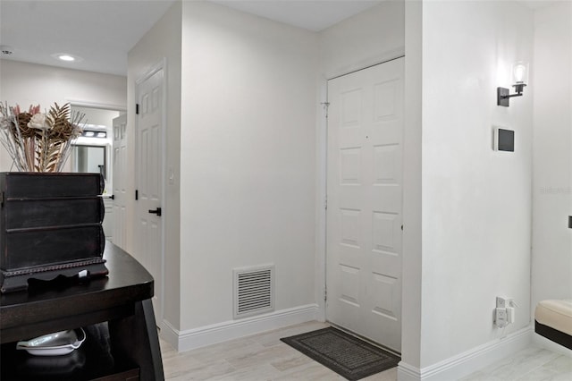 foyer entrance featuring light hardwood / wood-style flooring