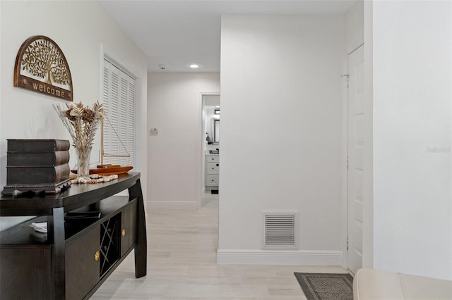 hallway with light wood-type flooring