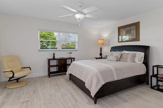 bedroom featuring ceiling fan and light hardwood / wood-style floors