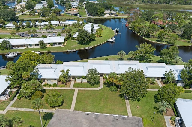 birds eye view of property featuring a water view and a residential view