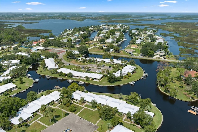 bird's eye view featuring a water view and a residential view