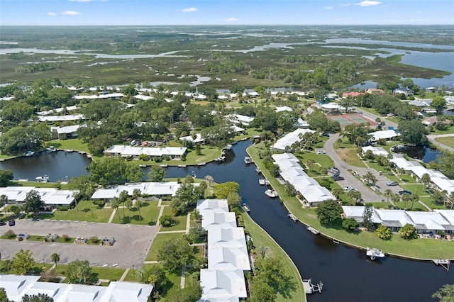 birds eye view of property featuring a water view and a residential view