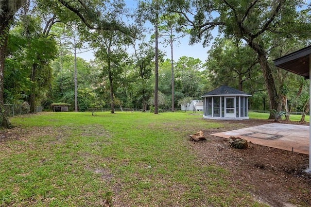 view of yard featuring a sunroom