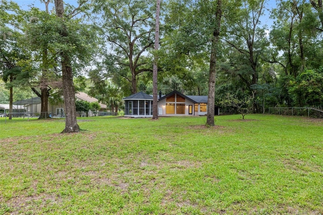 view of yard featuring a sunroom