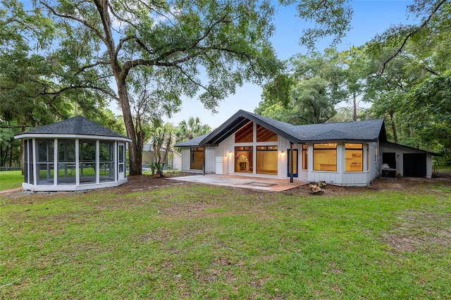 rear view of house featuring a yard