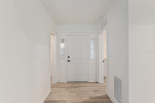 entrance foyer with light wood-type flooring