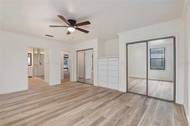 unfurnished bedroom featuring light hardwood / wood-style floors, crown molding, ceiling fan, and multiple windows