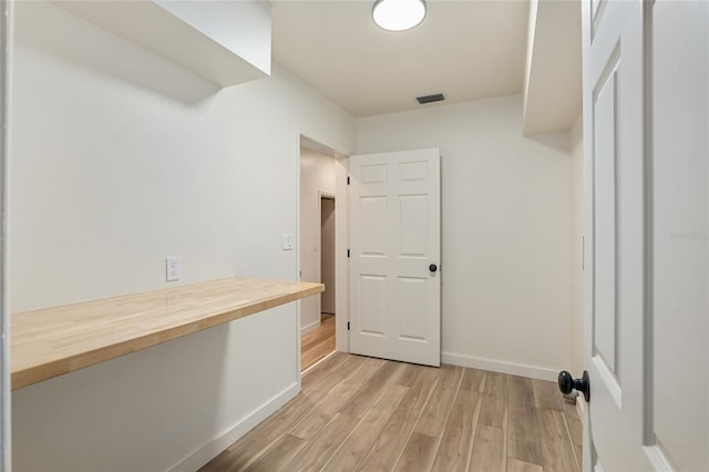 laundry area featuring light hardwood / wood-style flooring