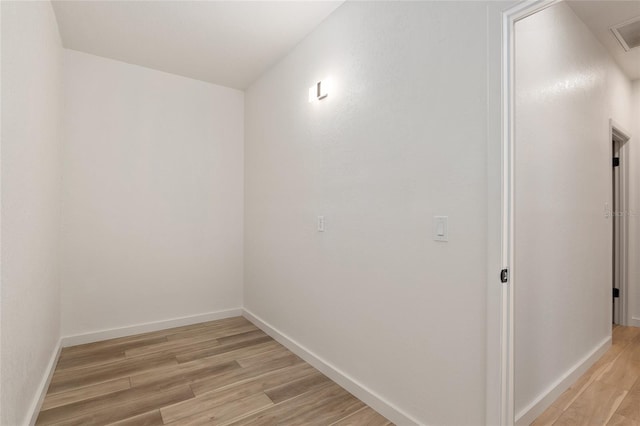 empty room with light hardwood / wood-style floors