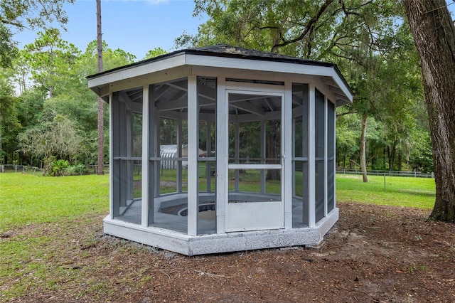 view of outdoor structure with a lawn