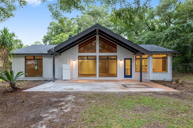 rear view of property featuring a patio area