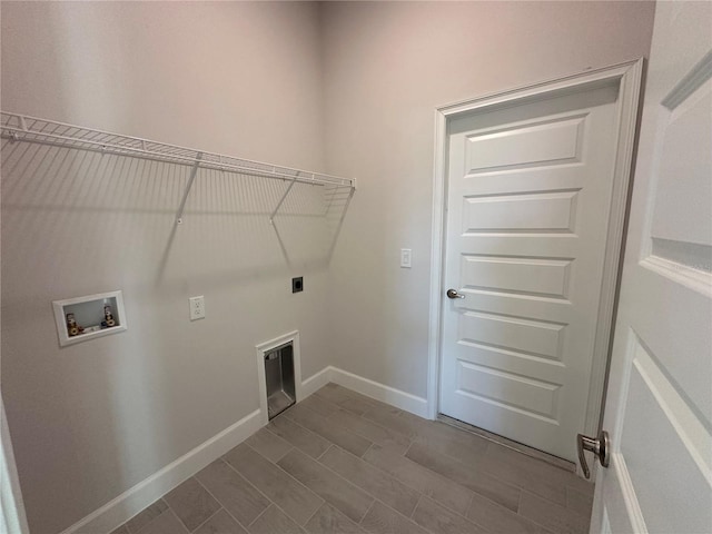 washroom with hookup for a washing machine, laundry area, electric dryer hookup, and baseboards