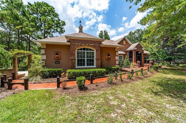 view of front of home with a front yard