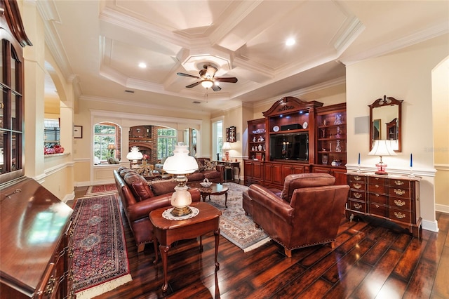 living room featuring ceiling fan, crown molding, hardwood / wood-style flooring, and coffered ceiling