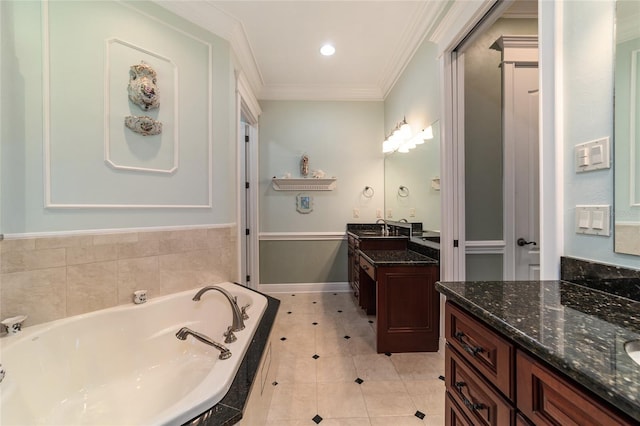 bathroom with tile patterned flooring, tiled tub, ornamental molding, and dual vanity