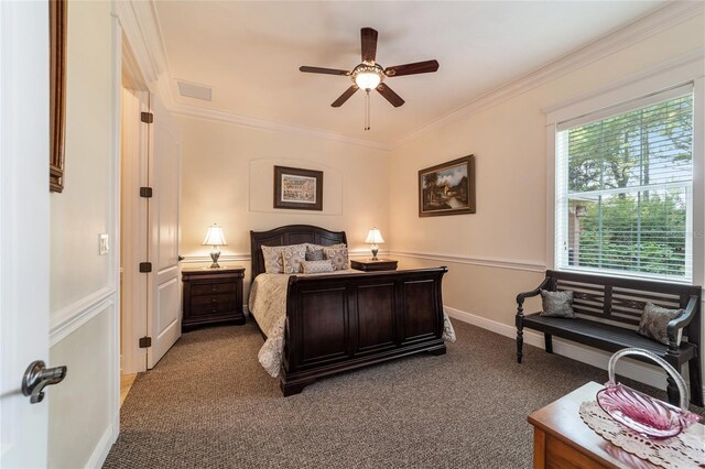 bedroom featuring ceiling fan, ornamental molding, and light carpet