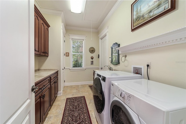 laundry room with light tile patterned floors, sink, ornamental molding, cabinets, and washer and dryer