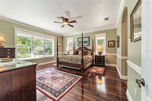 bedroom featuring ceiling fan, crown molding, and dark hardwood / wood-style flooring