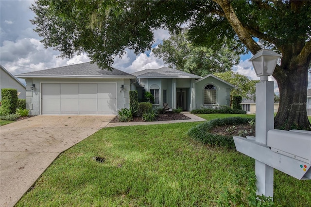 ranch-style home with a front yard and a garage