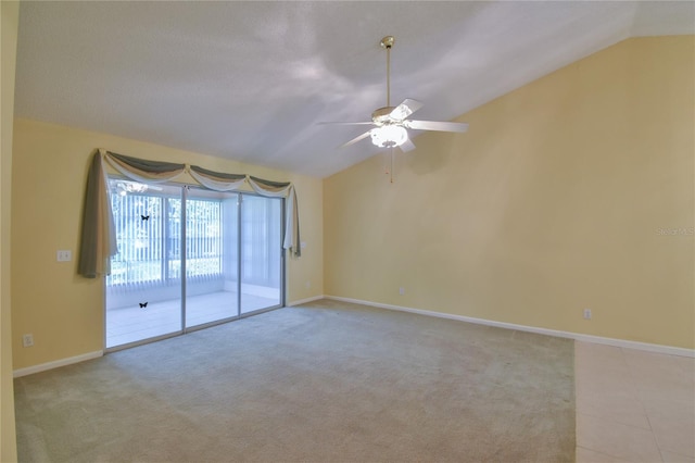 empty room with lofted ceiling, light carpet, and ceiling fan