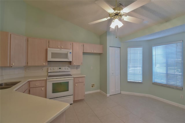 kitchen with light tile patterned flooring, lofted ceiling, white appliances, light brown cabinets, and ceiling fan