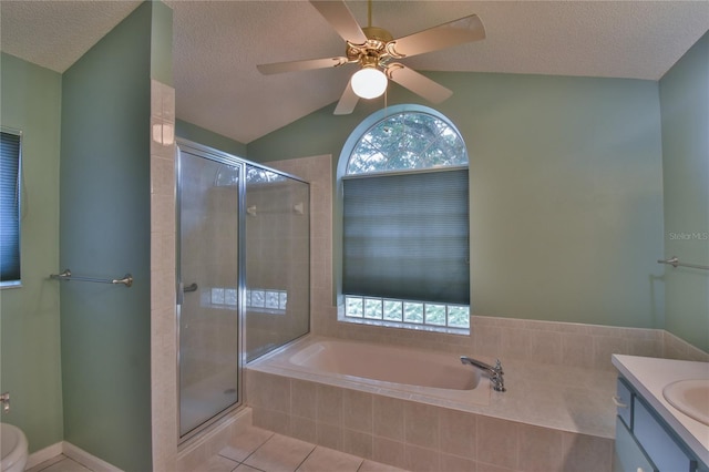 bathroom with shower with separate bathtub, lofted ceiling, ceiling fan, and vanity