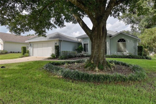 ranch-style house featuring a garage and a front lawn