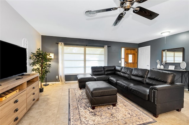 living room with ceiling fan and light tile patterned floors