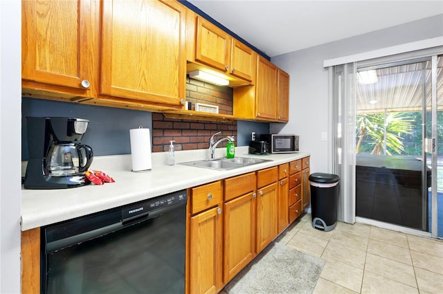 kitchen with black dishwasher, light tile patterned floors, sink, and tasteful backsplash