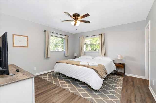 bedroom featuring ceiling fan and dark hardwood / wood-style flooring