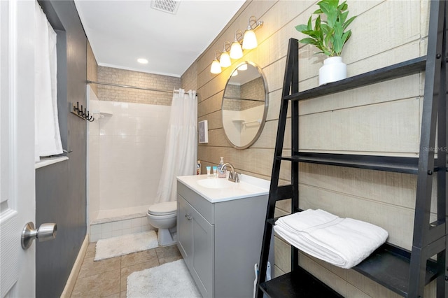 bathroom featuring tile patterned floors, a shower with shower curtain, vanity, and toilet