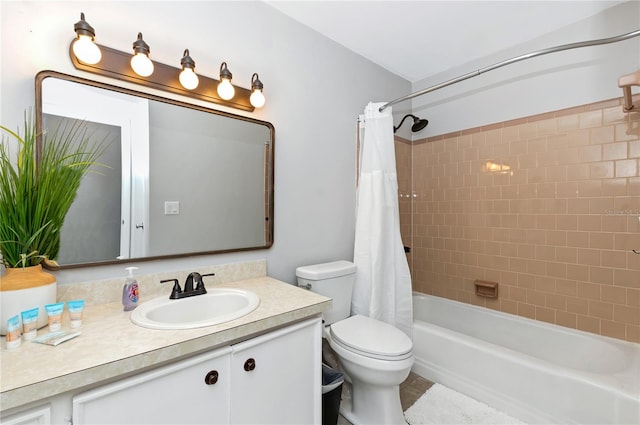 full bathroom with shower / bath combo, toilet, tile patterned floors, and vanity