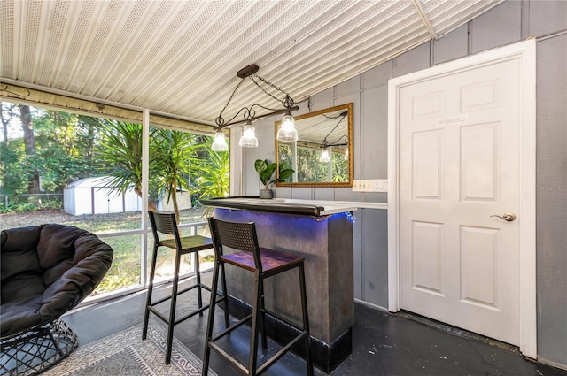 exterior space featuring a wealth of natural light and lofted ceiling