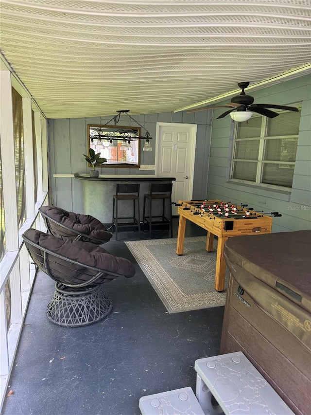 exterior space with ceiling fan