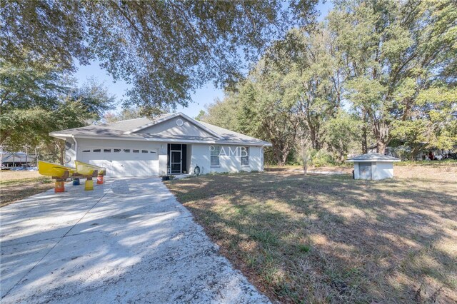 ranch-style house with a shed and a garage