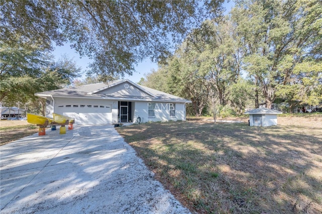 single story home with an attached garage and concrete driveway