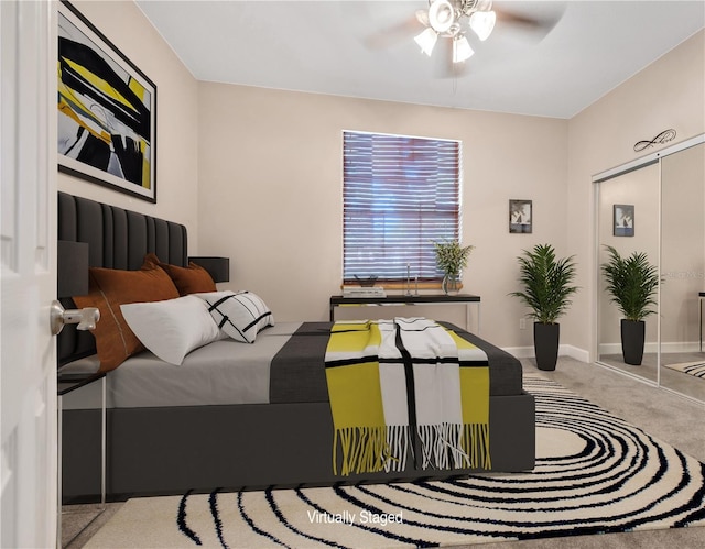 bedroom with carpet floors, a closet, baseboards, and a ceiling fan