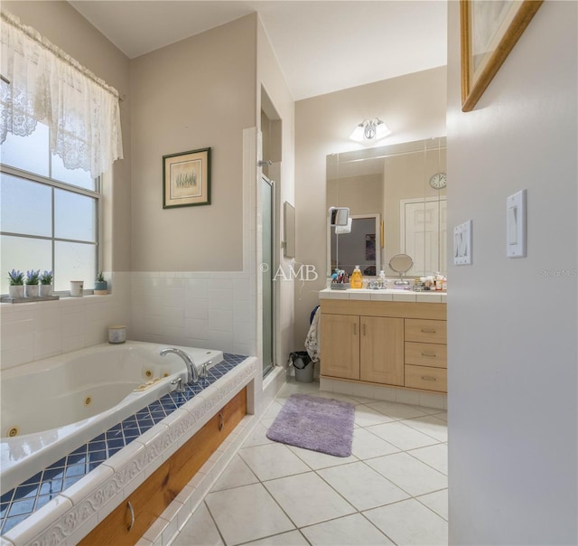 full bath with a whirlpool tub, a stall shower, vanity, and tile patterned floors