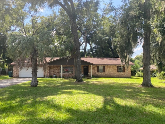 ranch-style house with a garage and a front lawn