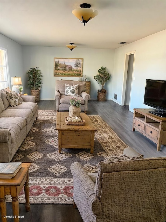 living room with dark wood-type flooring