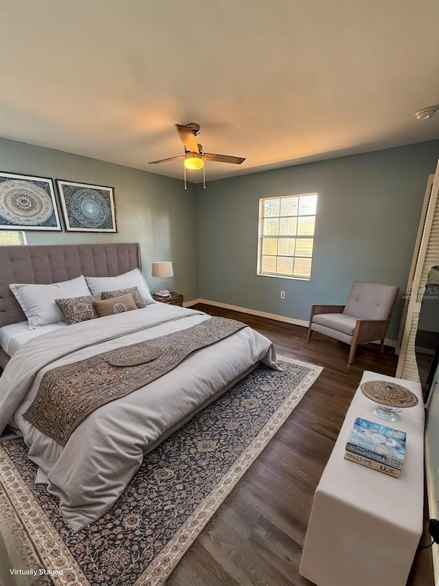 bedroom featuring dark wood-type flooring and ceiling fan