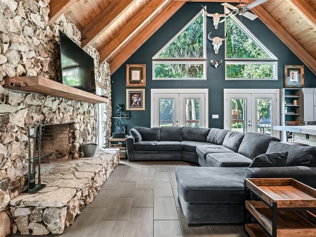 living room featuring a wealth of natural light, french doors, high vaulted ceiling, and wooden ceiling