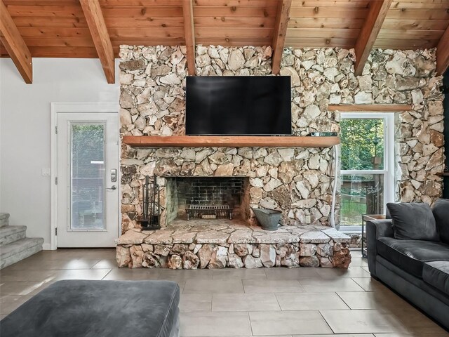 tiled living room with beam ceiling, a fireplace, and wood ceiling