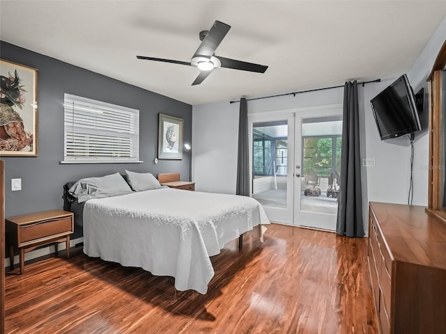 bedroom with access to exterior, ceiling fan, french doors, and dark hardwood / wood-style floors