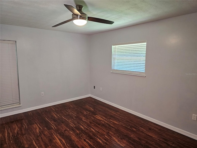 unfurnished room featuring a textured ceiling, dark hardwood / wood-style flooring, and ceiling fan