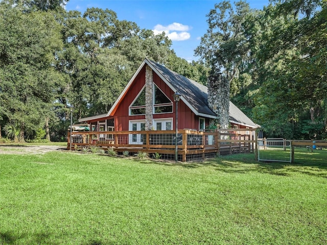 back of house with a lawn