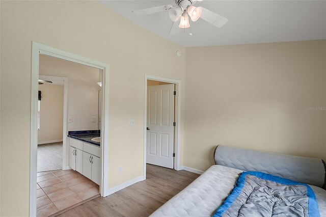 bedroom with ceiling fan and light hardwood / wood-style flooring