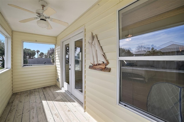 sunroom with ceiling fan and french doors