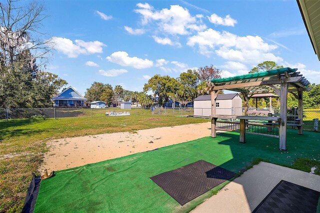 view of home's community featuring a yard and a pergola